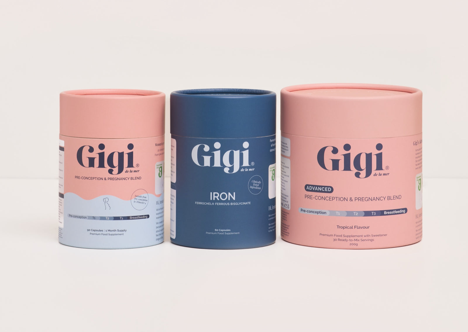 Gigi de la mer Pre-Conception & Pregnancy Blend, Iron and Advanced Tropical tubs on a blush background